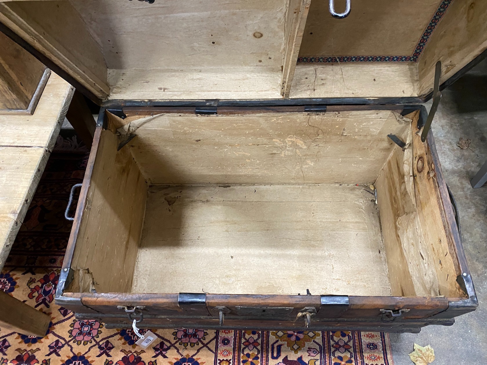 A Victorian wood and iron bound domed trunk, width 78cm, height 54cm, together with a smaller later cabin trunk